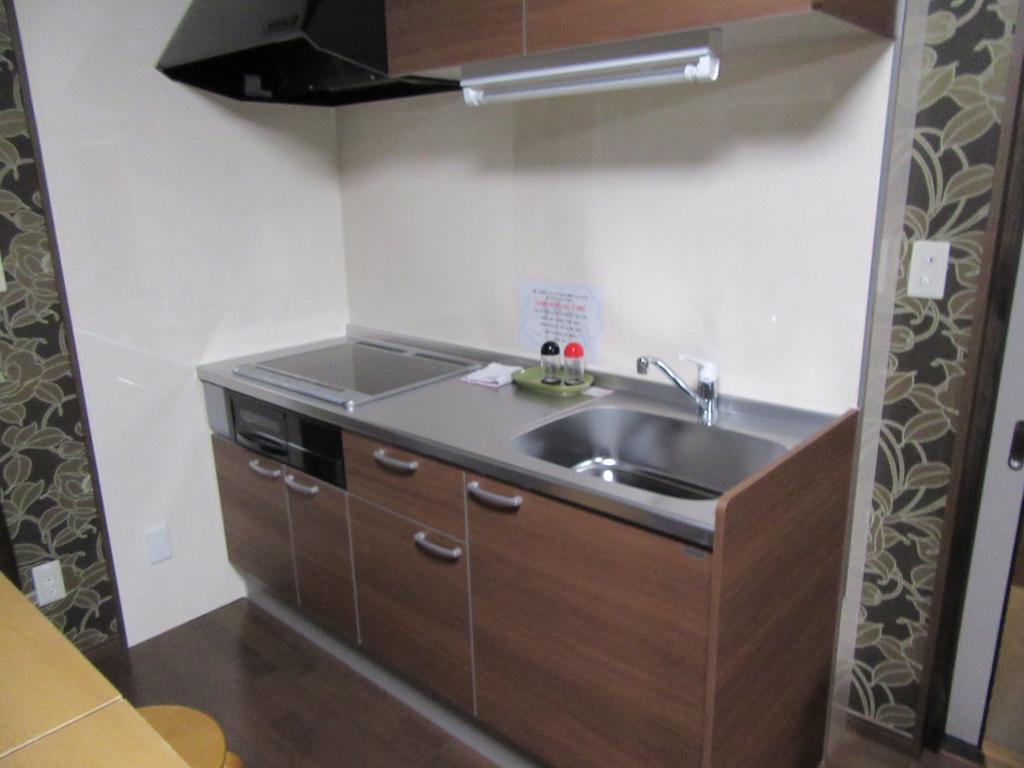 Guesthouse Tiga Kumamoto Habitación foto